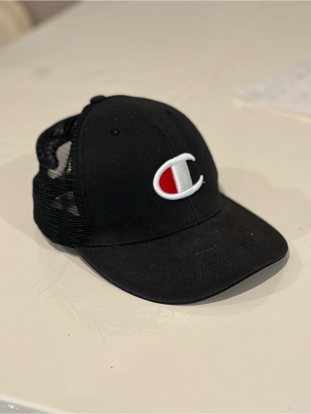 Champion Black Trucker Hat with Logo